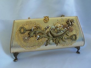 gold purse with feet