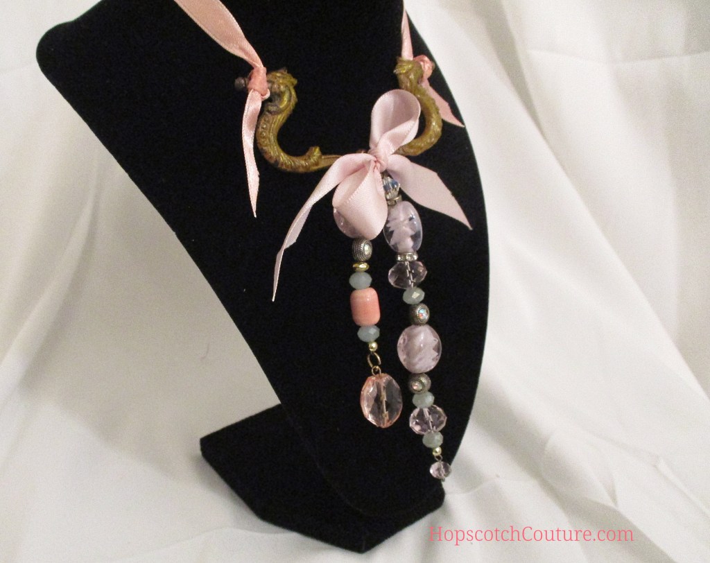 Close up right of pink glass beaded necklace. Made with vintage beads and antique hardware by Marelle Couture for Hopscotch Couture. https://hopscotchcouture.com/products/pink-dangle-necklace-glass-beaded-bridal-necklace-unique-upcycle-statement-pendant-romantic-victorian-jewellery-bijoux-rose-romantique?_pos=2&_sid=03bf9b8ba&_ss=r #pinknecklace #glassbeadednecklace #bridalnecklace