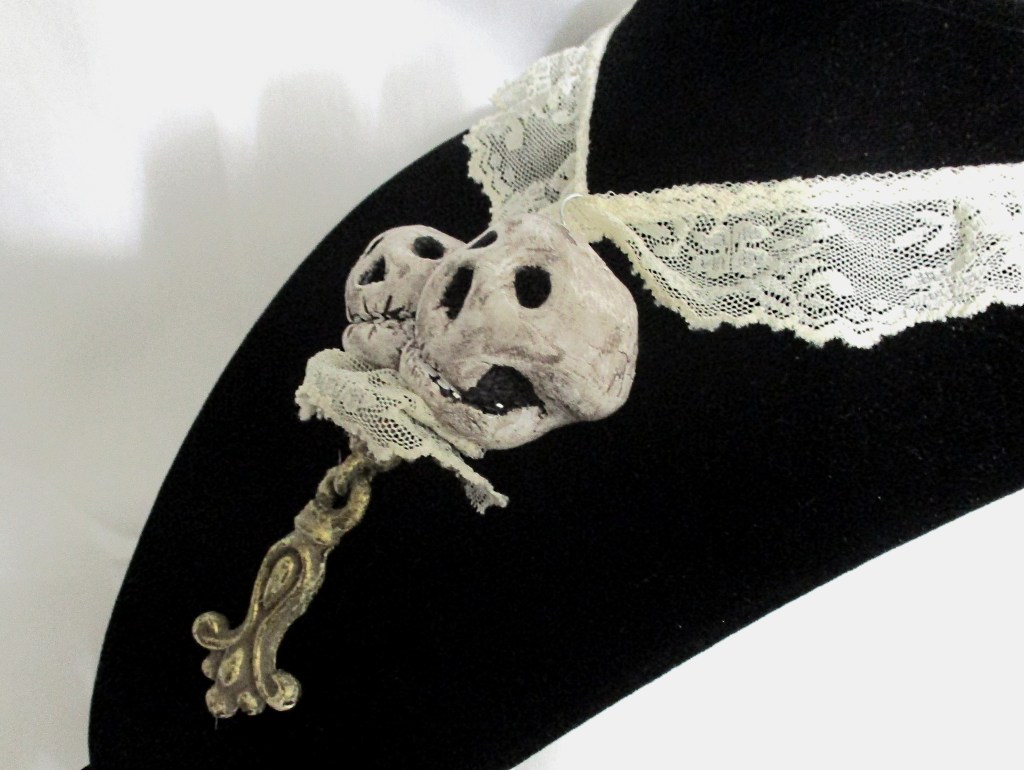 Right side close up Handmade skeleton, skull pendant necklace by Marelle Couture for Hopscotch Couture https://hopscotchcouture.com/products/romantic-skulls-pendant-pendentif-crane-skeleton-necklace-a-couple-of-snuggly-skulls-jewelry-ooak?_pos=1&_psq=twin&_ss=e&_v=1.0 #skullnecklace #skeletonnecklace #skullsnecklace