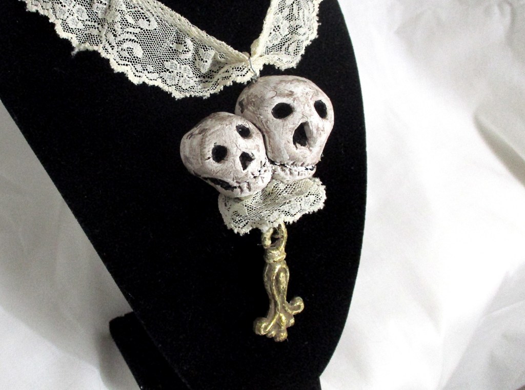 Handmade skeleton, skull pendant necklace by Marelle Couture for Hopscotch Couture https://hopscotchcouture.com/products/romantic-skulls-pendant-pendentif-crane-skeleton-necklace-a-couple-of-snuggly-skulls-jewelry-ooak?_pos=1&_psq=twin&_ss=e&_v=1.0 #skullnecklace #skeletonnecklace #skullsnecklace