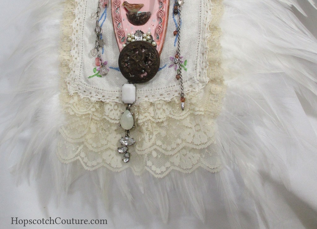Bottom of Large Lace Trimmed Feather Bib Neck Piece. Bridal Necklace made from Vintage Victorian Lace by Marelle Couture for Hopscotch Couture. https://hopscotchcouture.com/ #BridalNeckPiece #LargeLaceBibNecklace #FeatherBibNecklace