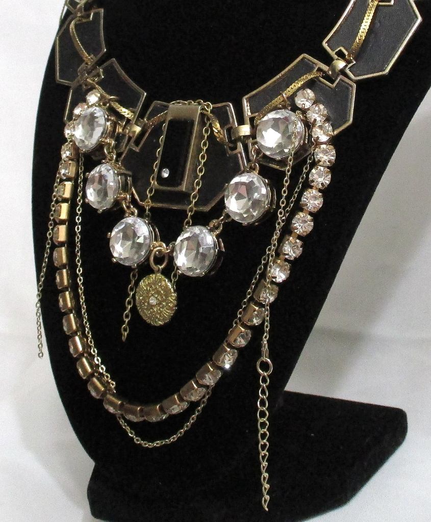 close up of The Ritz, Statement Black and gold rhinestone statement necklace handmade by Marelle Couture for Hopscotch Couture. https://hopscotchcouture.com/ #statementnecklace #theritz #blackrhinestonenecklace #rhinestonenecklace
