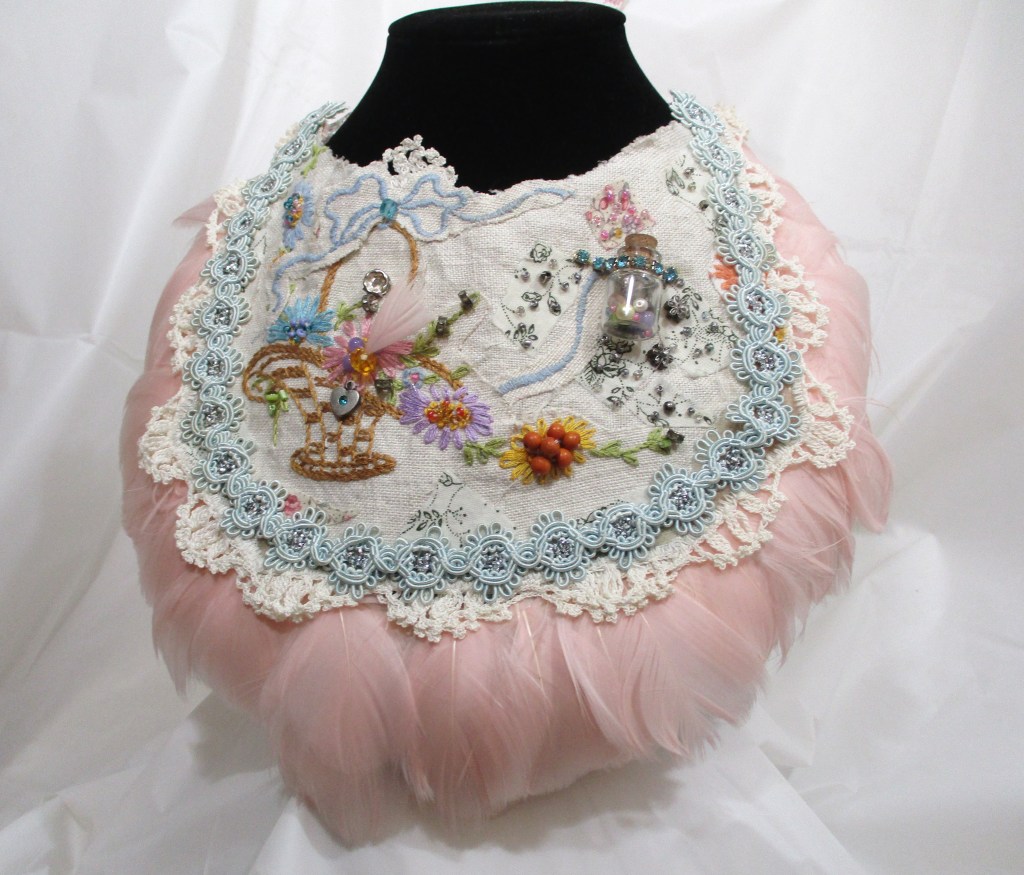Pink Feather Bib Bridal Necklace by Marelle Couture for Hopscotch Couture. https://hopscotchcouture.com/ #Bridalbibnecklace #featherbibnecklace #handmadebridaljewelry #MarelleCouture