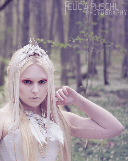 model wearing a Bridal Bib Necklace, and glass beaded hair combs by Marelle Couture.  Angel Wing Custom made to order necklace by Marelle Couture. https://hopscotchcouture.com/products/angel-wing-necklace-custom-order-statement-bib-bridal-couture-necklace-ooak-royal-plume-neck-piece-by-marelle-made-to-order-jewelry?_pos=1&_psq=angel+wing&_ss=e&_v=1.0 #bridalnecklace #angelwingnecklace #statementnecklace